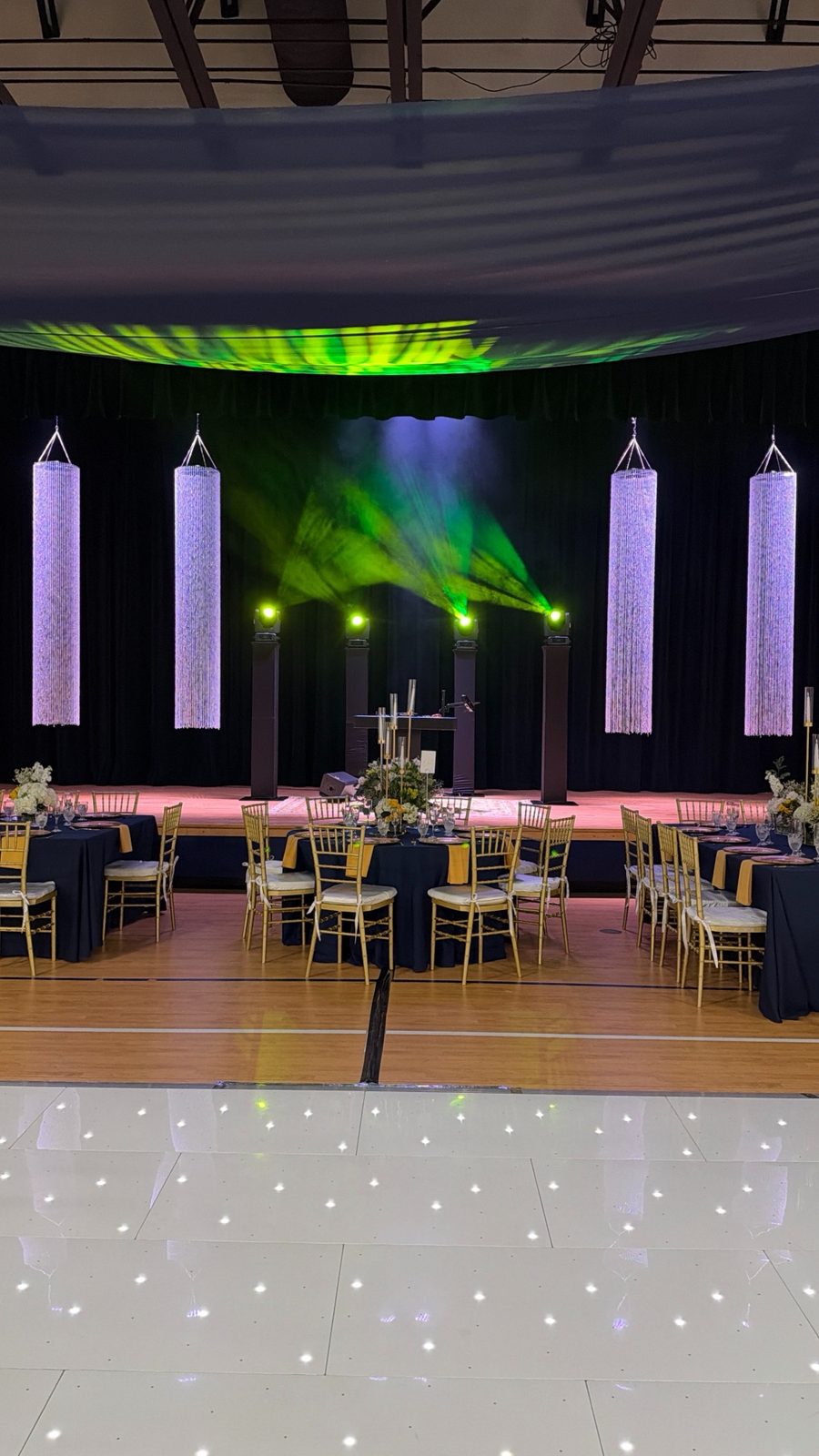 Gala banquet hall with full stage production and LED dance floor