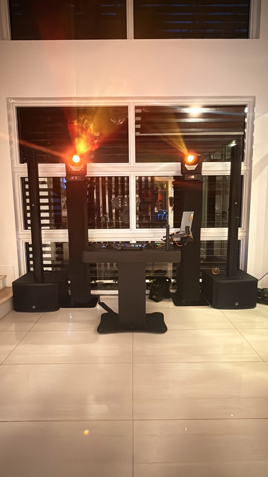 DJ setup with dramatic red stage lighting