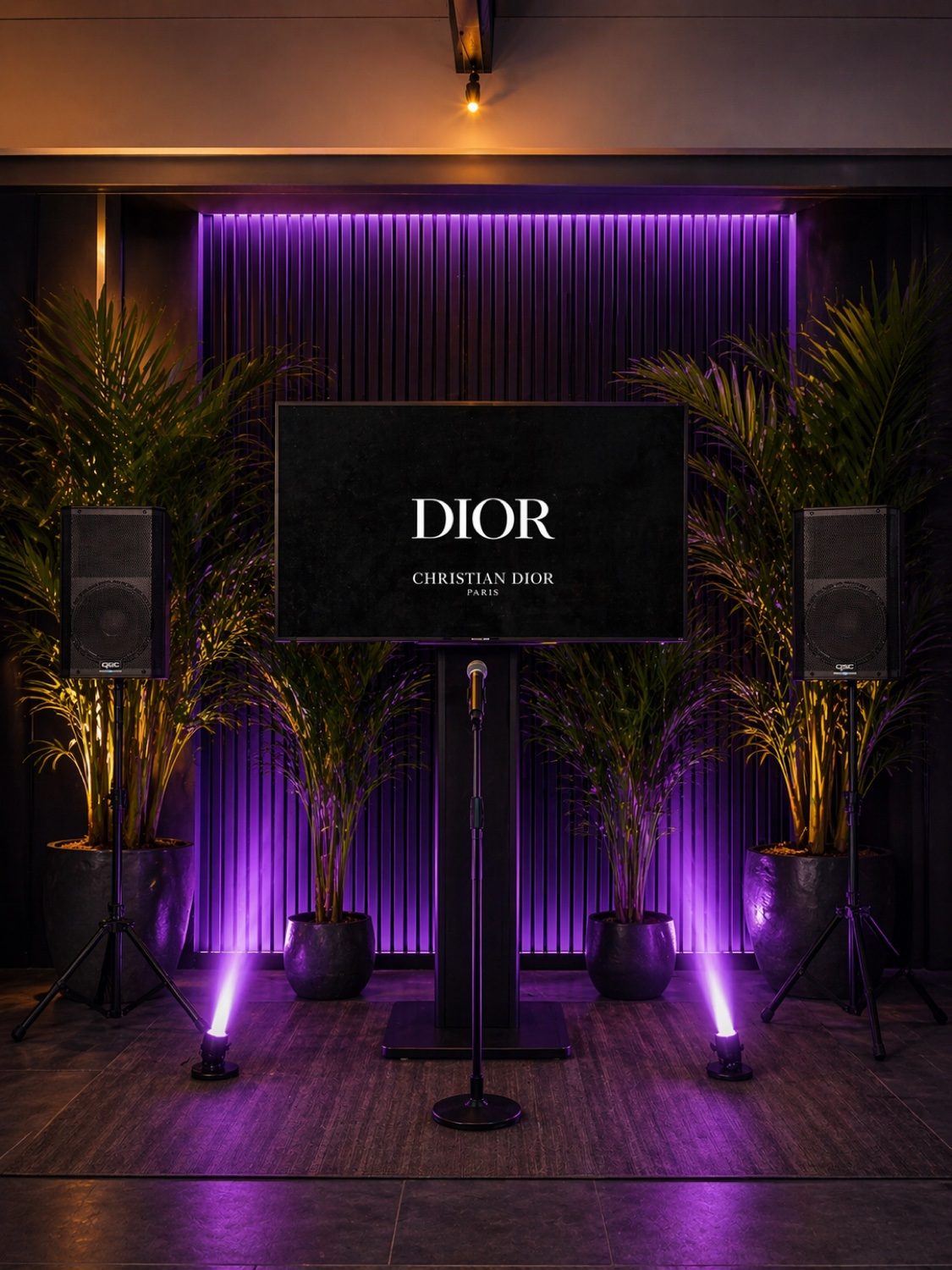 Branded corporate event setup with purple architectural lighting