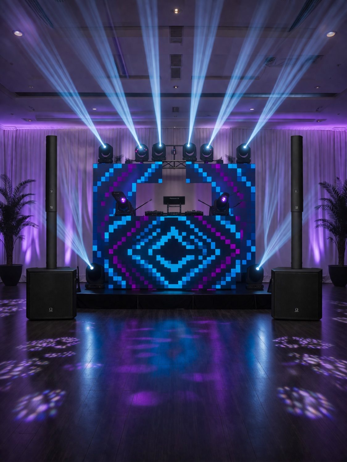 DJ booth with blue and purple LED pixel wall