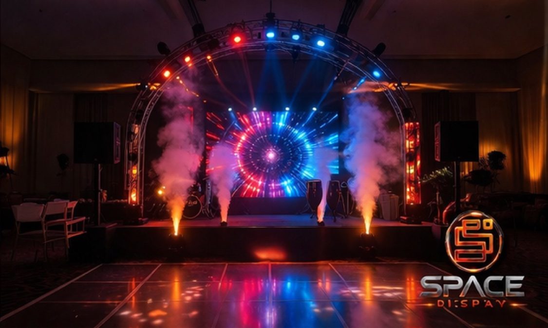 Concert-style stage with truss arch, LED wall and CO2 effects
