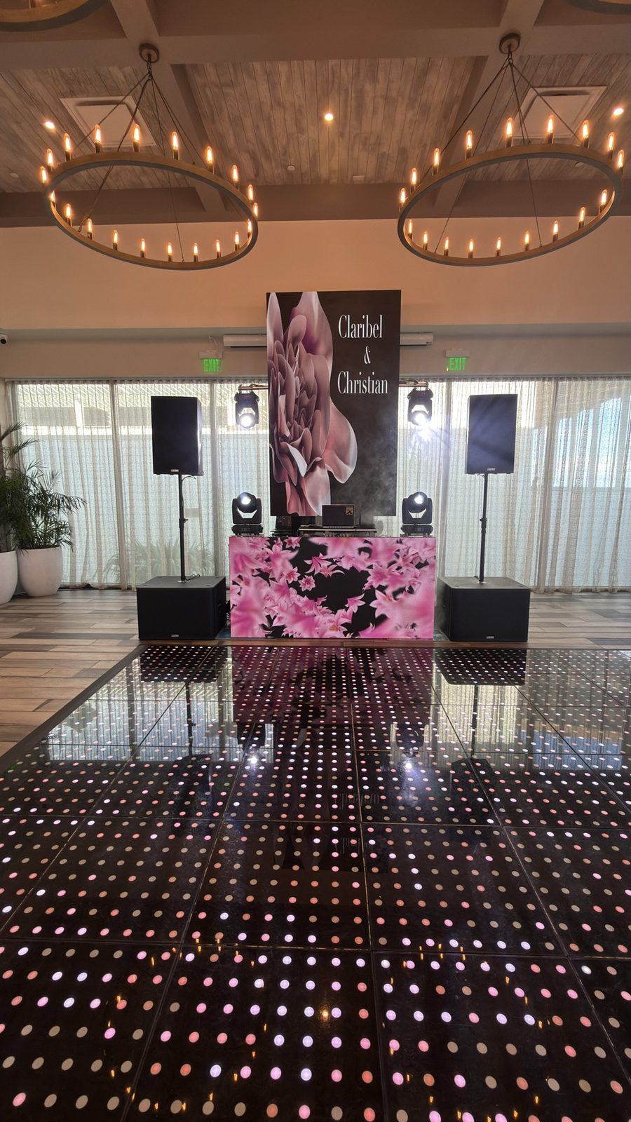 Wedding DJ booth with floral LED design and LED dance floor