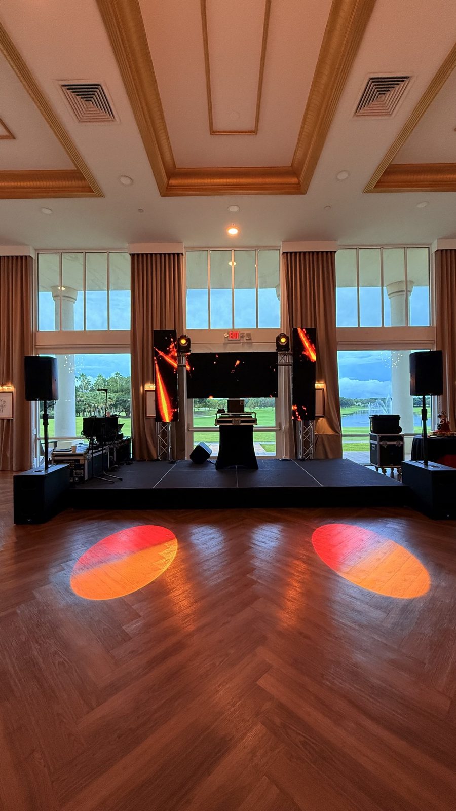 Ballroom stage with LED screens overlooking a golf course