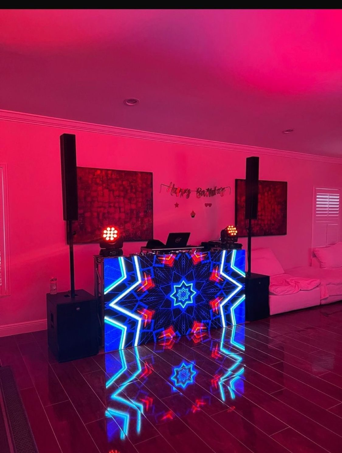 Birthday party DJ setup with colorful LED booth