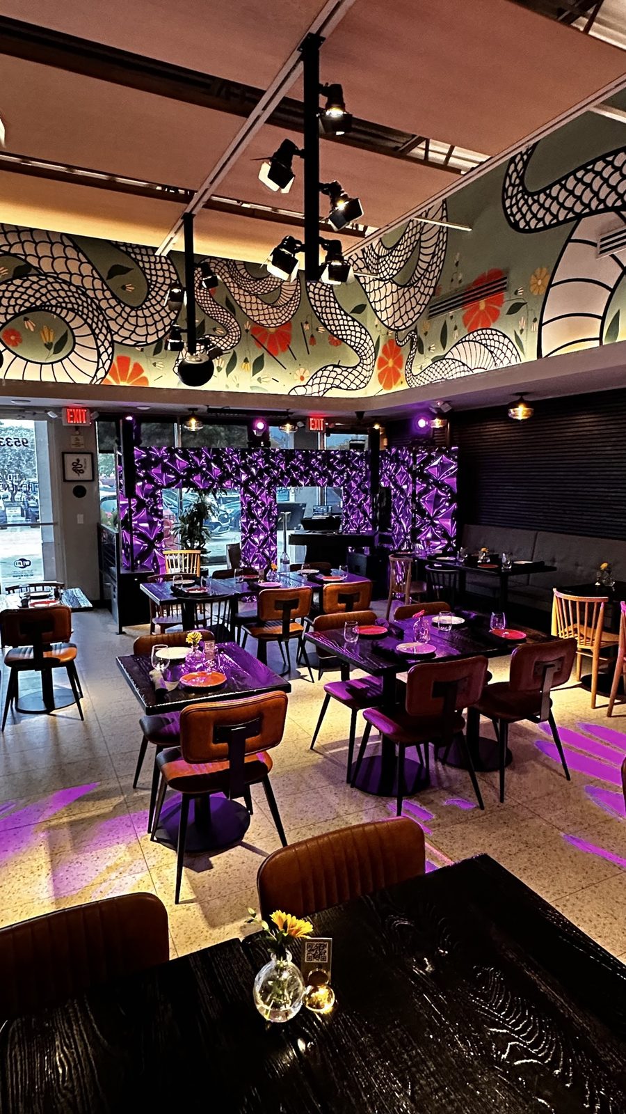 Restaurant venue with purple LED wall installation