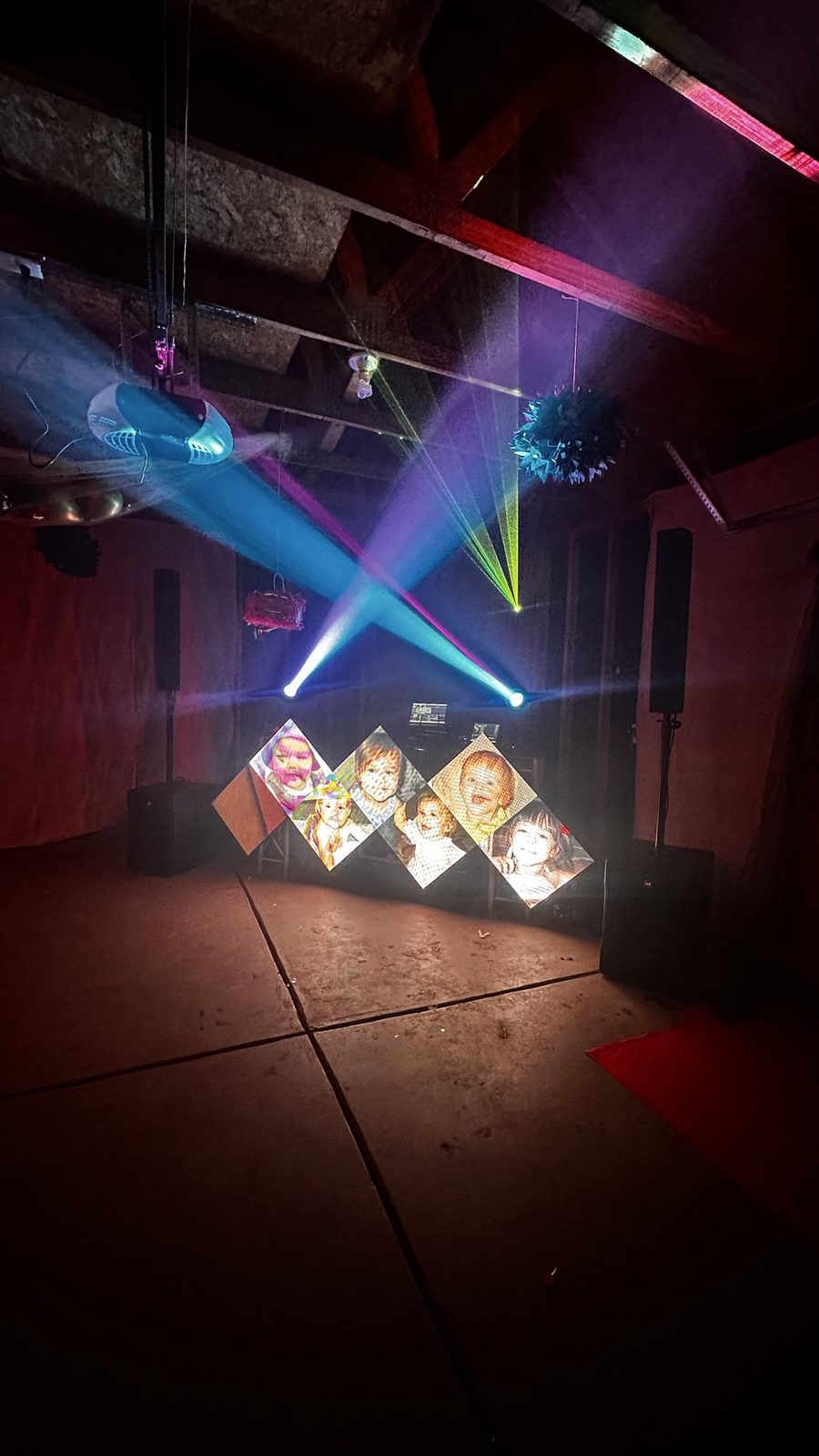 Kids party DJ setup with LED wall and laser beams