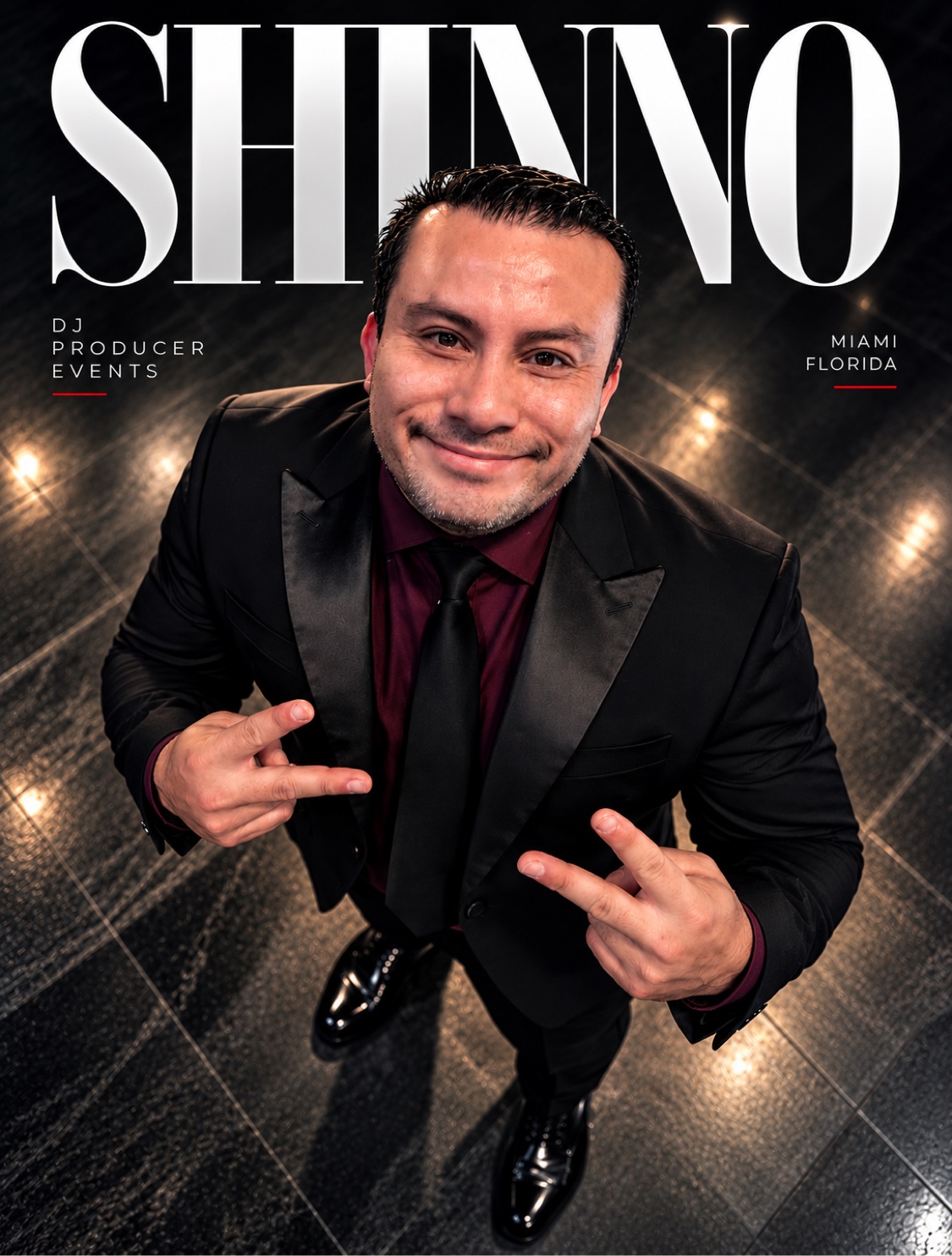 SHINNO in a black suit for an official portrait